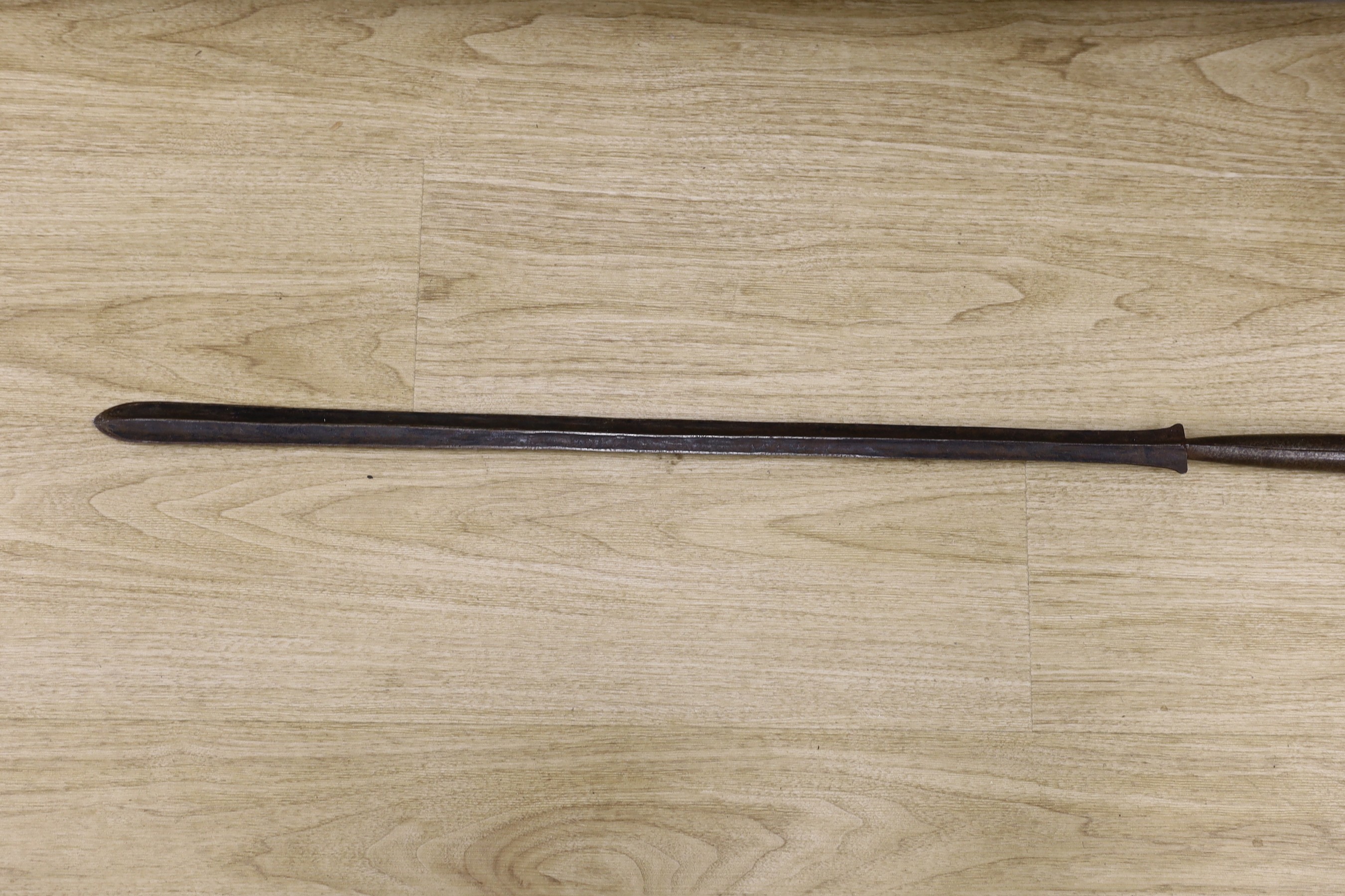 An African Boule crouched tribal figure, together with a spear, 156cm long